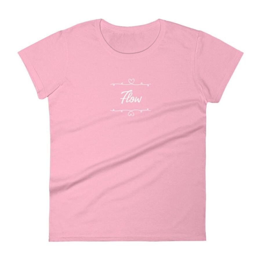 A women's pink t-shirt featuring the word Flow With Heart.