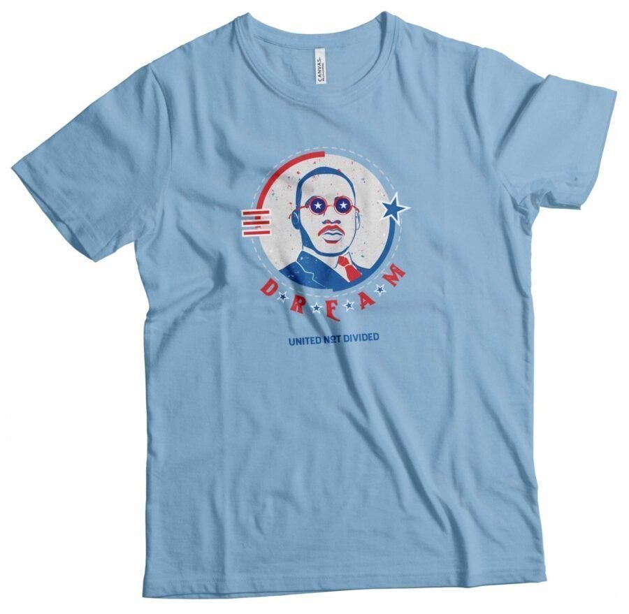 An Independence Day 4th July "DREAM" Martin Luther Heavy Cotton Tee with an image of a man wearing glasses.