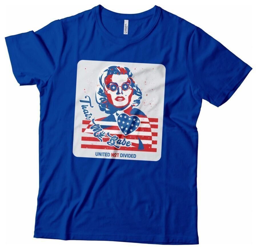 A blue Independence Day 4th July "THATS MY BABE" Marilyn Monroe Unisex Heavy Cotton Tee with an image of a woman wearing an American flag for Independence Day.