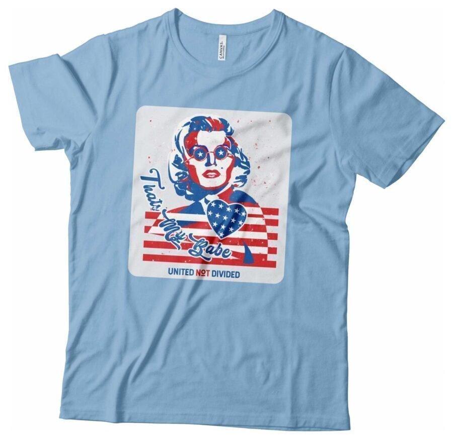 A light blue Independence Day 4th July "THATS MY BABE" Marilyn Monroe Unisex Heavy Cotton Tee with an image of a woman wearing an American flag for Independence Day.