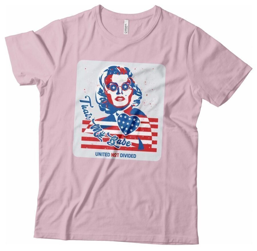 A pink Independence Day 4th July "THATS MY BABE" Marilyn Monroe Unisex Heavy Cotton Tee with an image of a woman wearing an American flag, celebrating Independence Day.