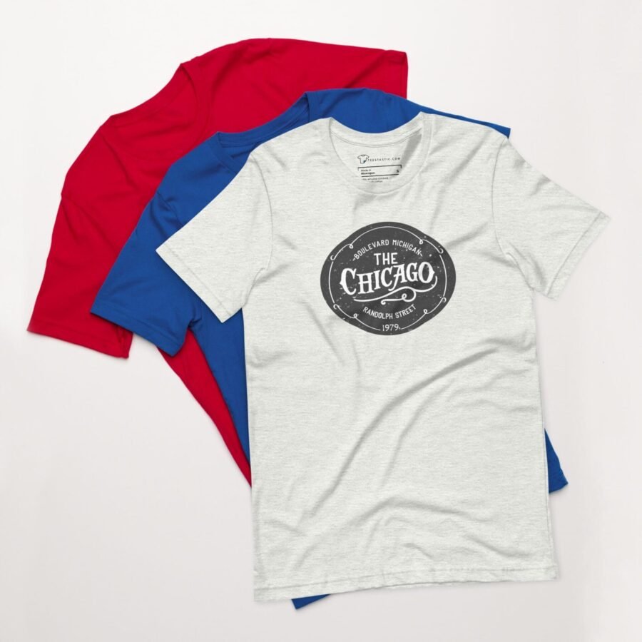 Three The Chicago Unisex T-Shirts with the word 'covered' on them.