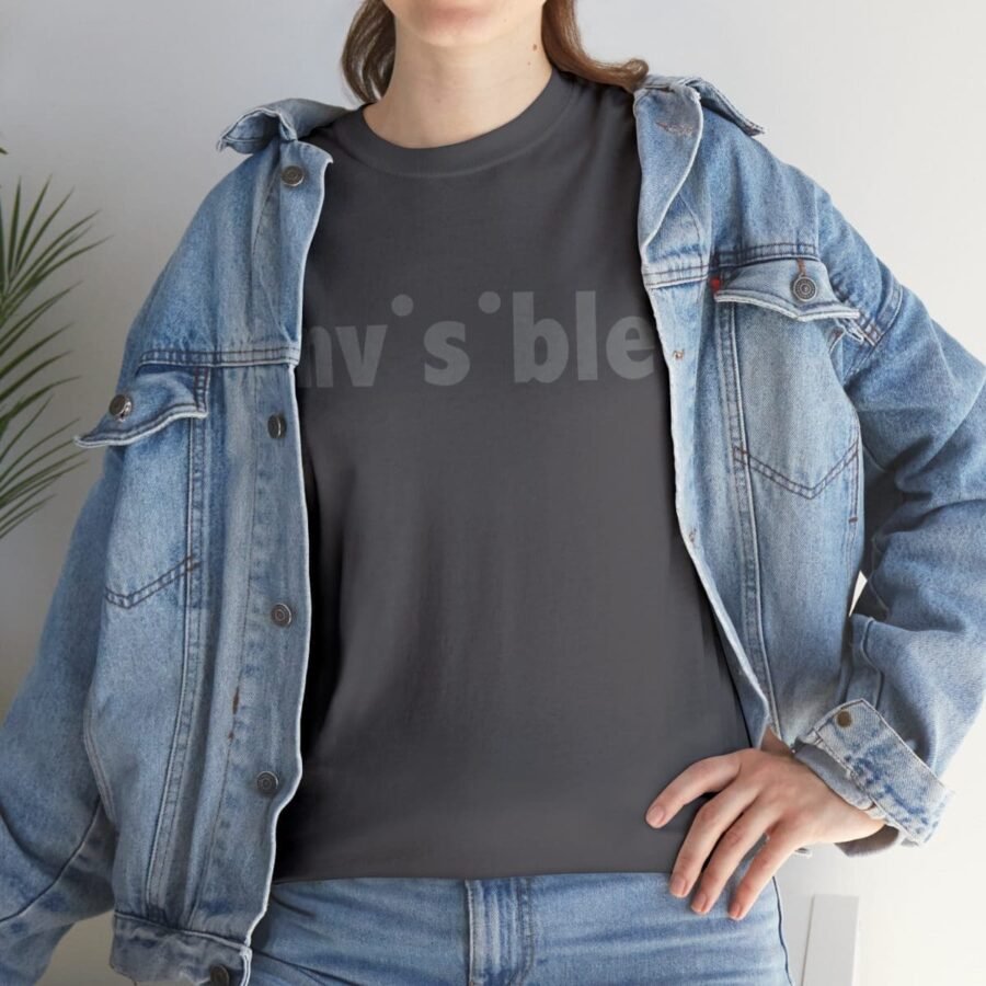 A woman wearing an invisible denim jacket and an Invisible Unisex Heavy Cotton Tee that says "I'm blessed".