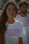 A woman with long hair and a man in a white shirt wearing humorous T-shirts.