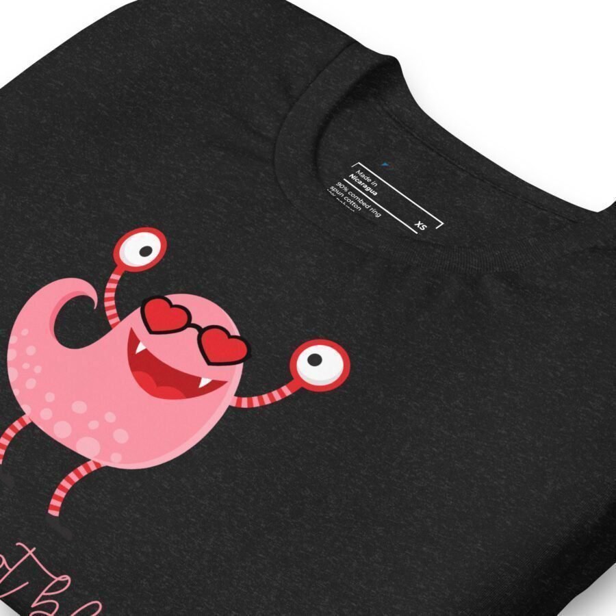 A unisex black t-shirt with a pink monster on it: "Love is not blind | Unisex Heavy Cotton".