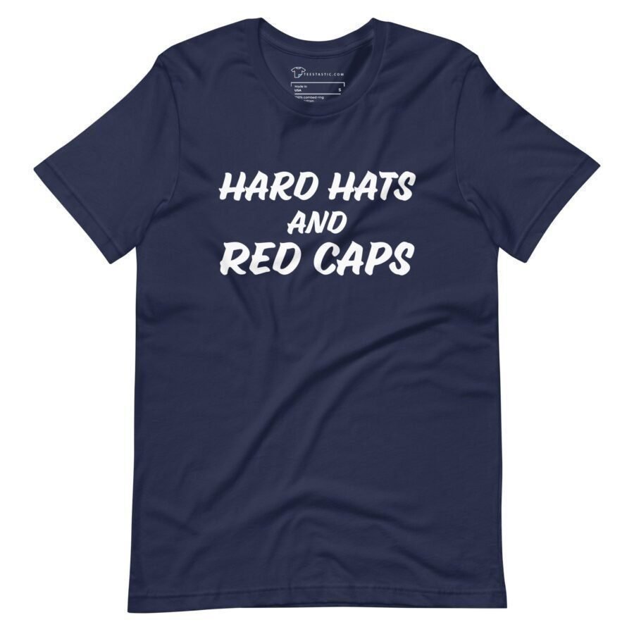 The "Hard Hats And Red Caps | Elections 2024 | Unisex t-shirt" is a navy blue, unisex t-shirt featuring the bold text "HARD HATS AND RED CAPS" in white, capital letters on the front, perfect for showing your spirit as Elections 2024 approaches.