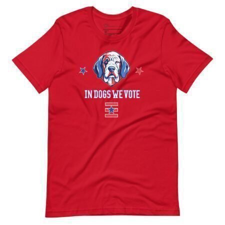 A unisex t-shirt in red, showcasing a printed design of a dog's face, two stars, and the text "In Dogs We Vote," ideal for expressing your support during Elections 2024.