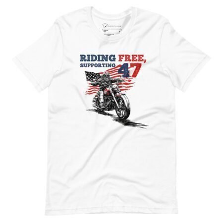 Introducing the "Riding Free | Elections 2024" unisex white T-shirt, featuring a motorcycle design, American flag, and the text "Riding Free, Supporting 47". Perfect for showing your support as we head into Elections 2024.