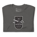 The Pioneer Unisex T-shirt in dark green, size M (Medium), features a vintage aviation design with a dual-engine jet plane and text honoring the service of a Retired Jet Airline Aviator.