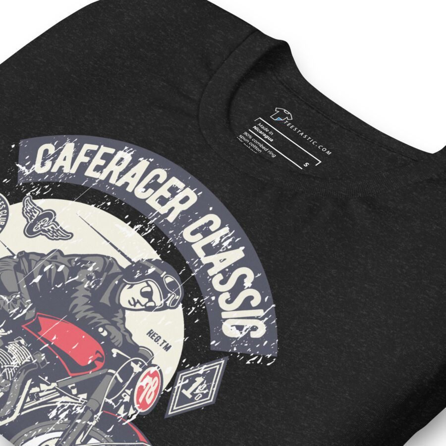 Close-up of a black Cafe-Racer Classic | Unisex Heavy Cotton Tee featuring a vintage-style motorcyclist graphic and the text "CAFERACER CLASSIC".