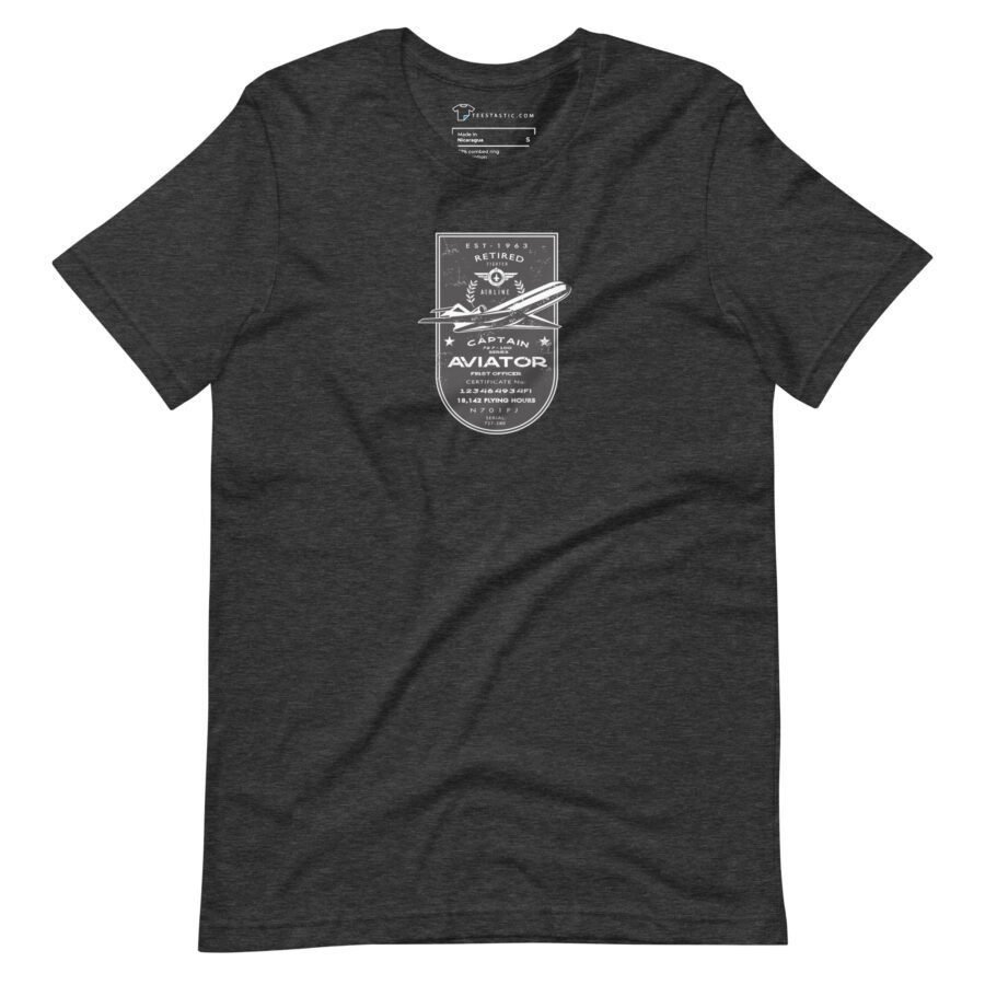 A unisex dark gray T-shirt that showcases a graphic of an airplane with the text "Captain Aviator," featuring an insignia adorned with technical specifications, stars, and subtle nods to the iconic Airline Jet 727.