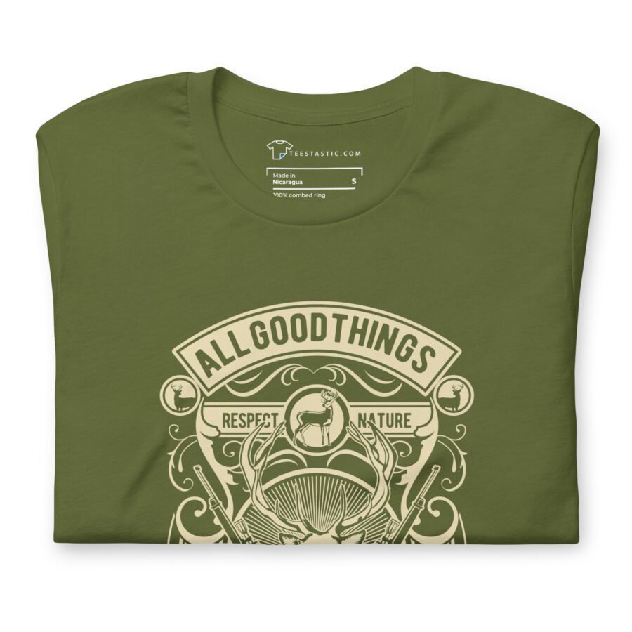 A folded All Good Things Are Wild And Free Unisex Heavy Cotton Tee in olive green showcases a nature-inspired design, with the words "All Good Things Are Wild And Free" and "Respect Nature" elegantly printed in beige.