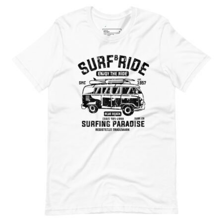 The Surf & Ride | Surfing Paradise | Unisex Heavy Cotton Tee showcases a black graphic text "Surf & Ride" and an illustration of a van with surfboards. It highlights "Surfing Paradise" and "Enjoy the Ride," along with extra details in smaller print.