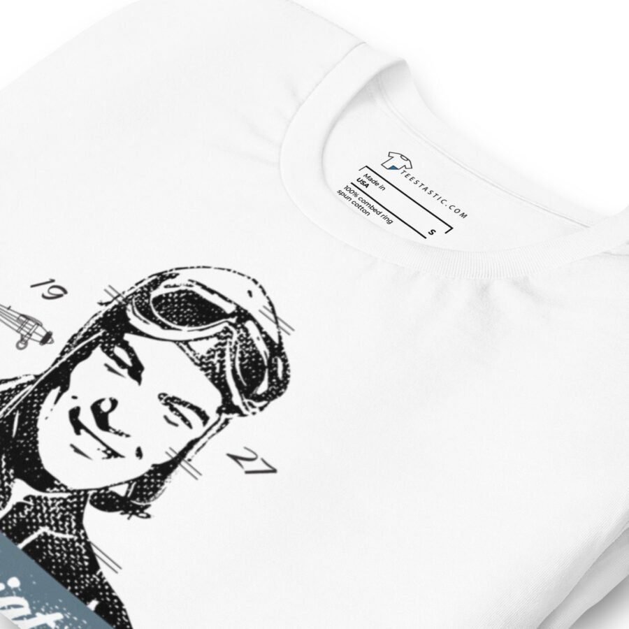 Unisex t-shirt showcasing a vintage 1927 black and white illustration of a smiling aviator adorned with goggles and a cap.